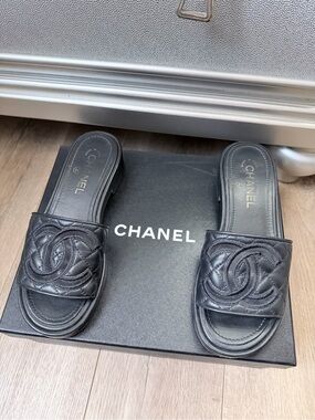 CHANEL Black Quilted Leather Slide Mules with CC Motif
